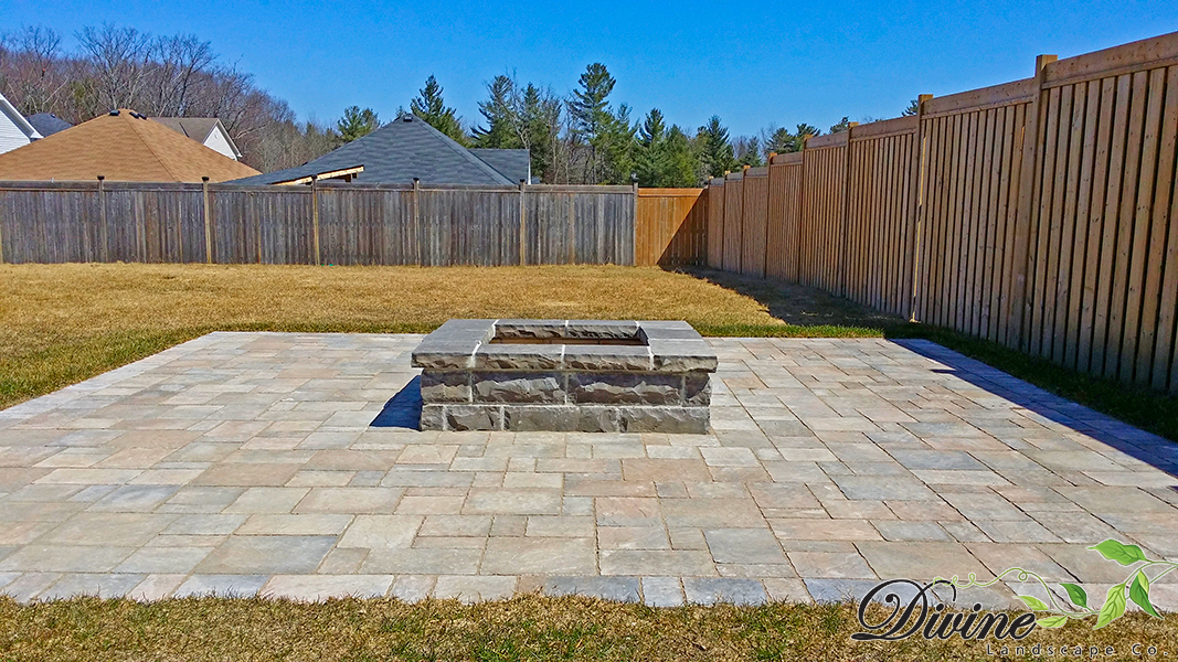 Custom stone fire pit and surrounding patio